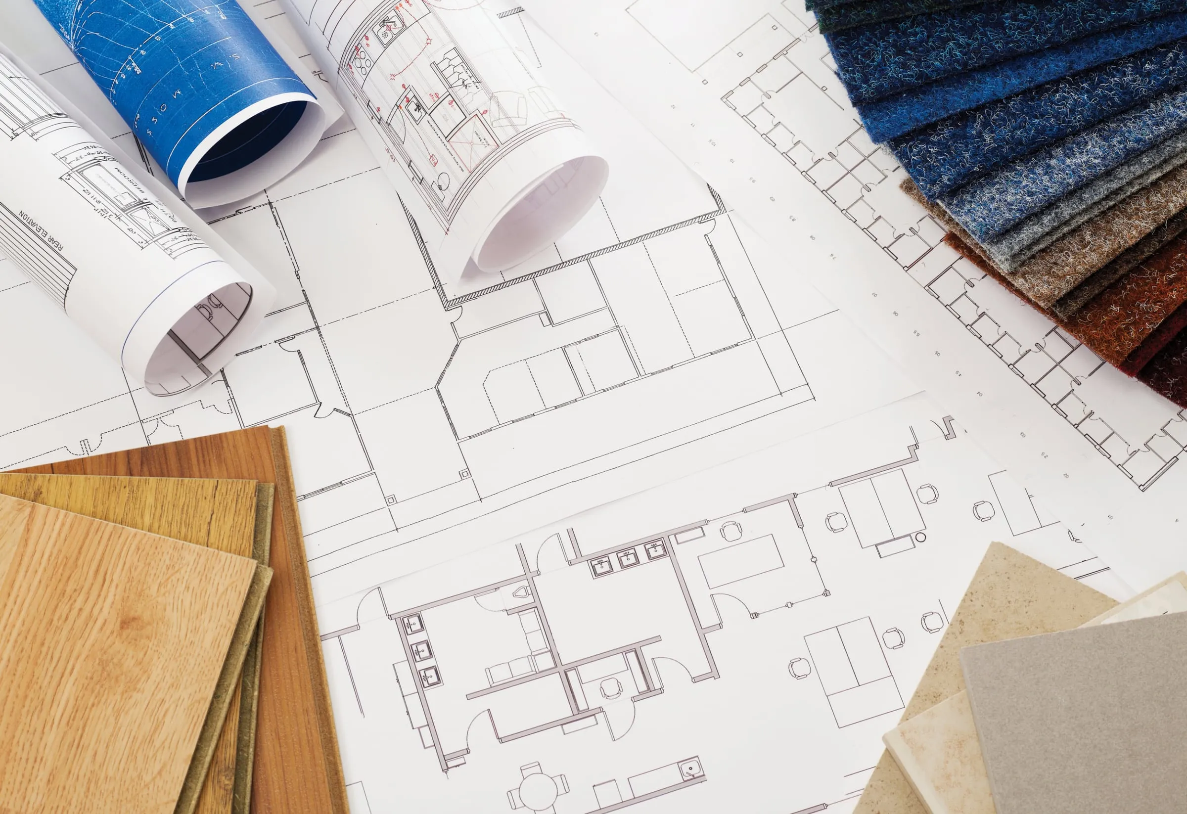 Floor plans and finish samples on a table