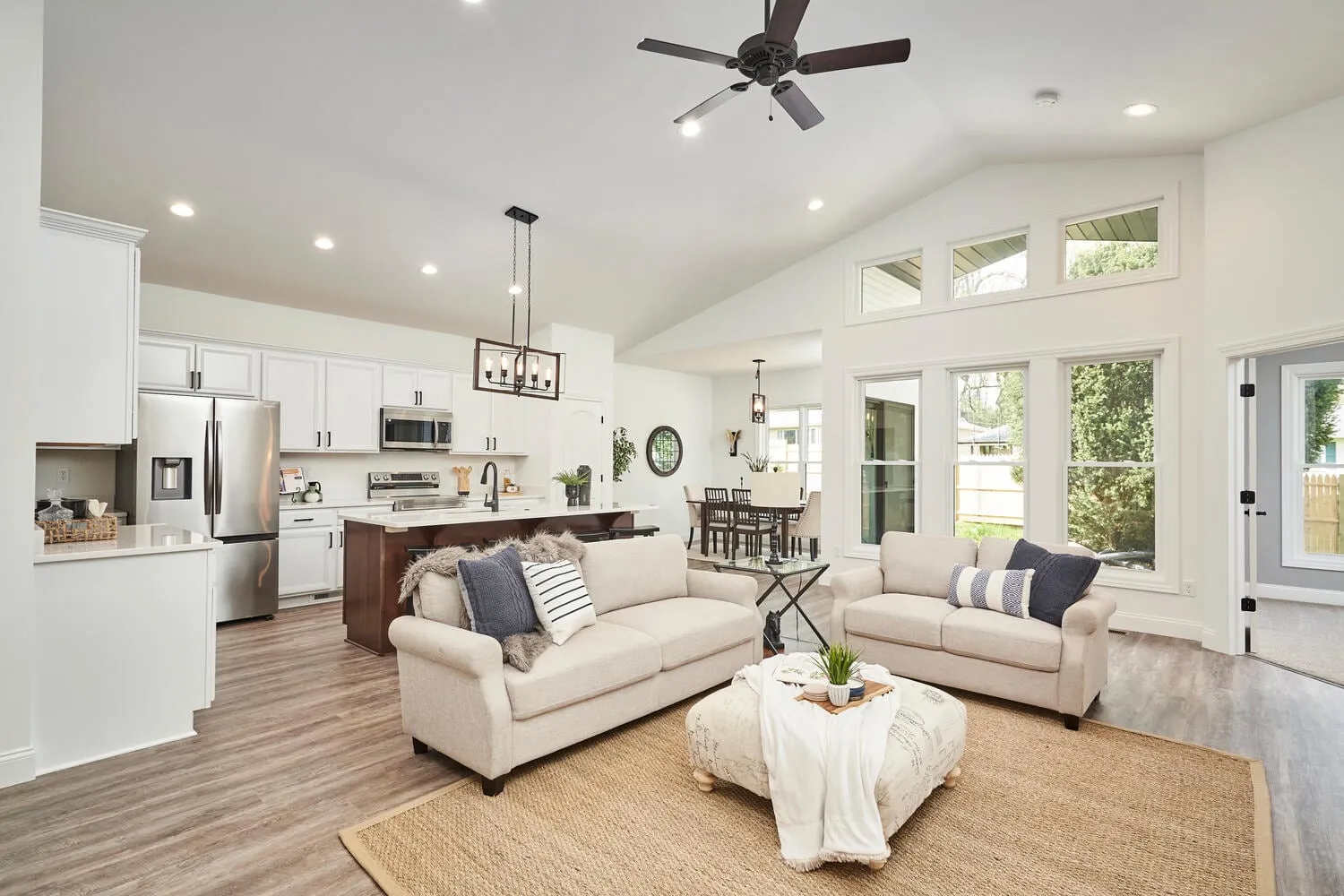 Briarwood great room with white cabinetry and vaulted ceiling