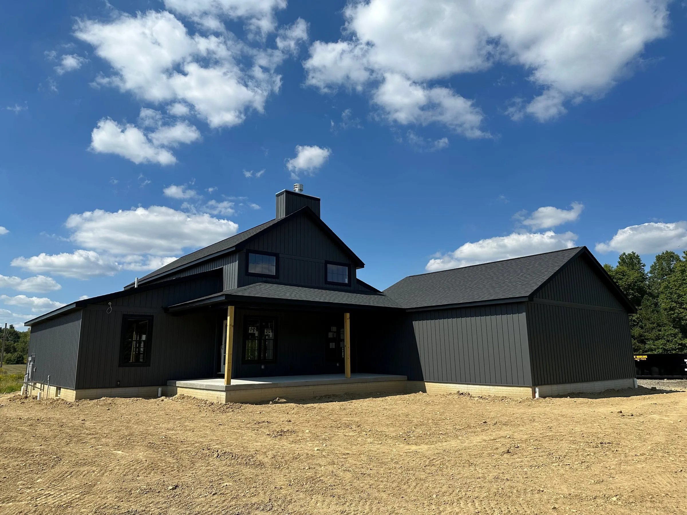 The finished custom home with its covered porch