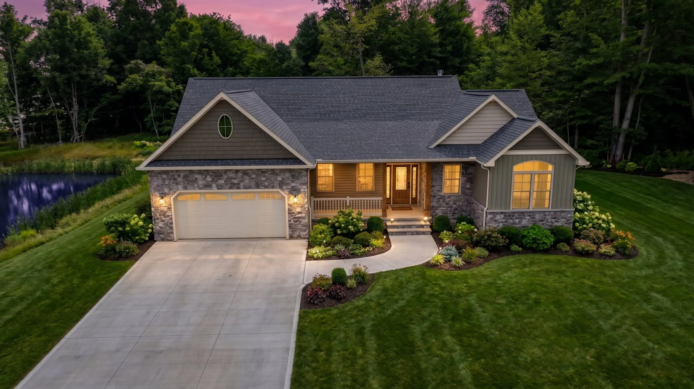 Front elevation at dusk under a pink sky