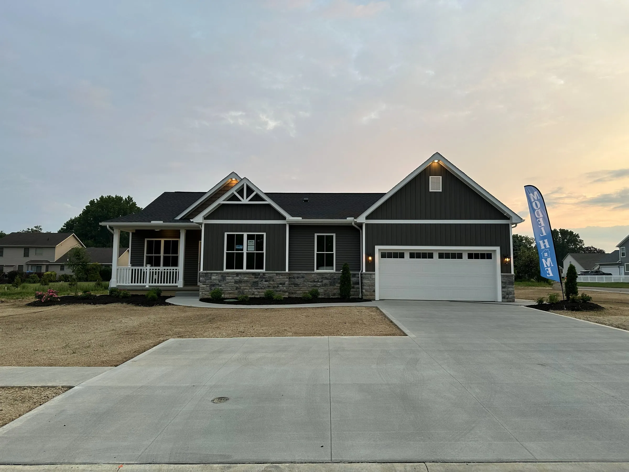The furnished Willow Run model home with the Hahn Homes flag out front