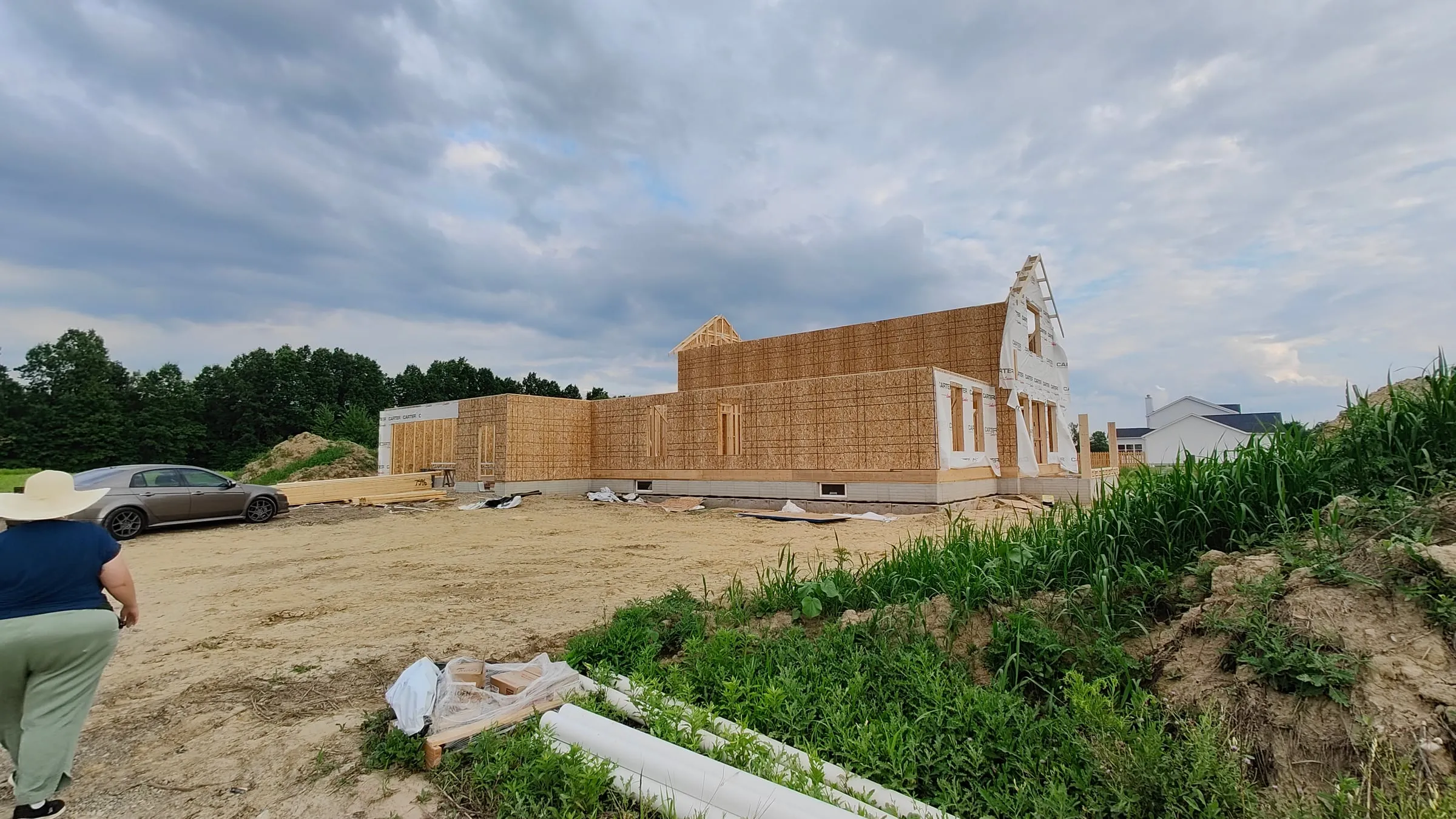 A home being framed under a bright sky