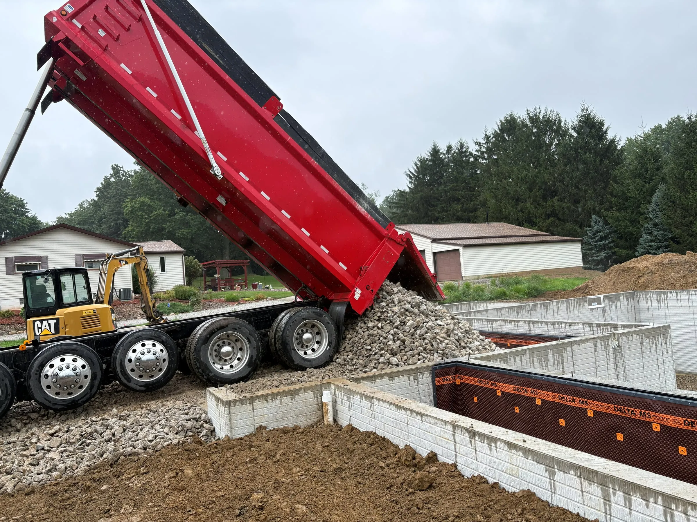 Gravel being delivered to a new foundation