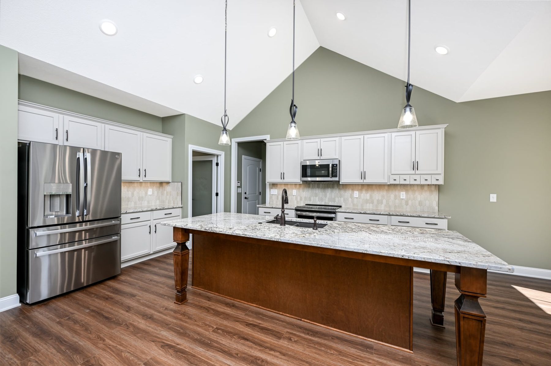 Kitchen with a granite island and pendant lighting