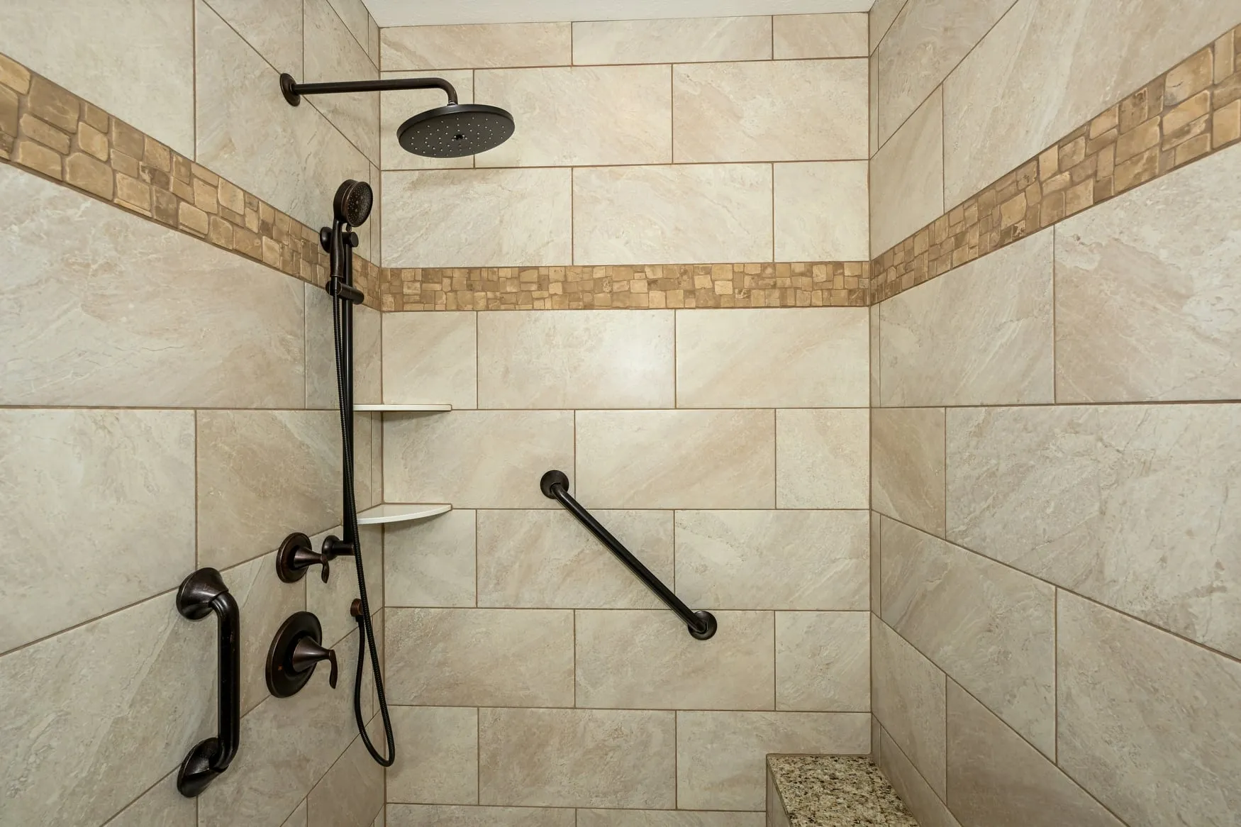 Tiled walk-in shower with a rain head