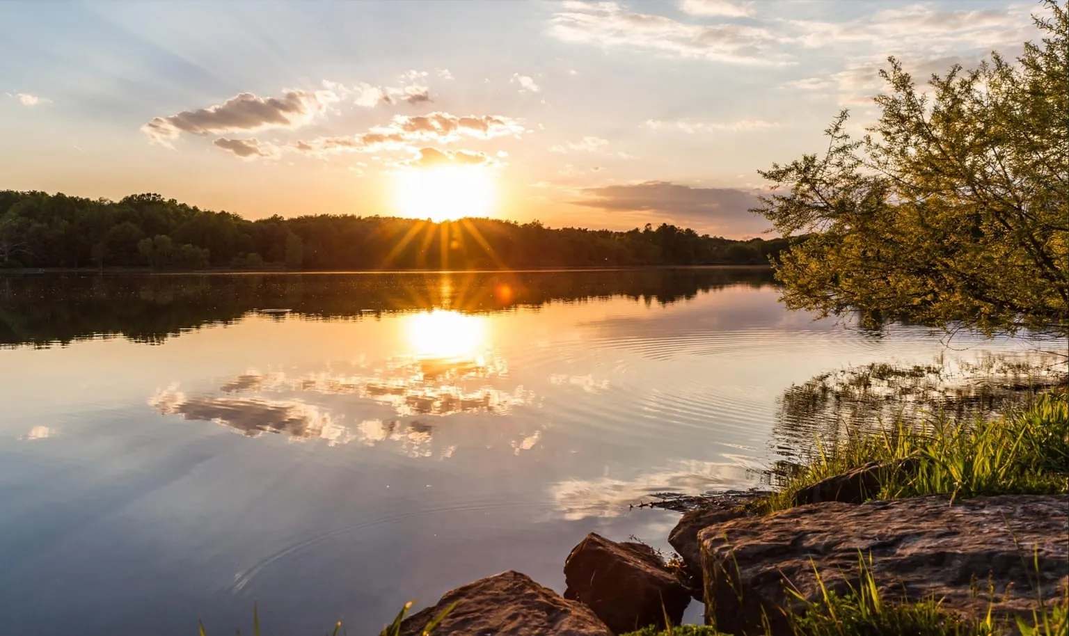 Sunset over the lake at Silver Creek Metro Park